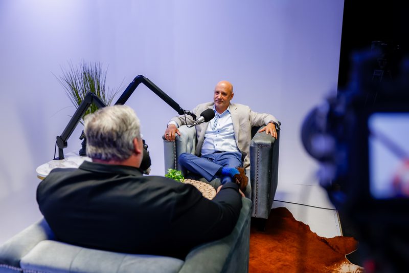 Michael Sarner mid-conversation during the taping, studio camera in the foreground